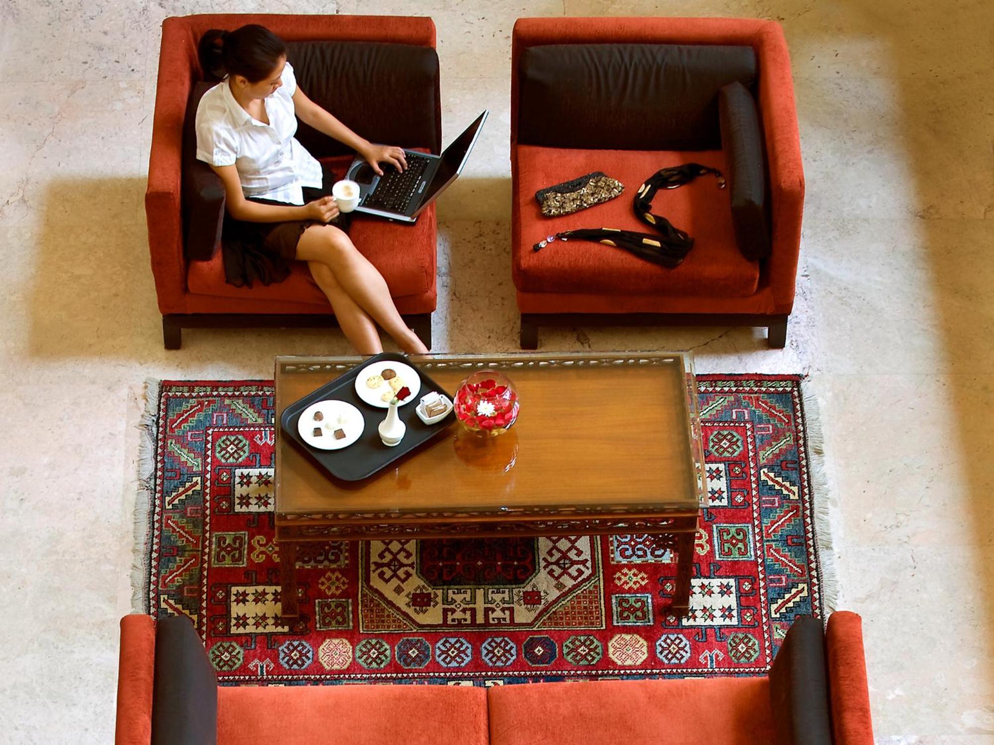 The Lalit Mumbai Hotel Bagian luar foto A student studying in the library