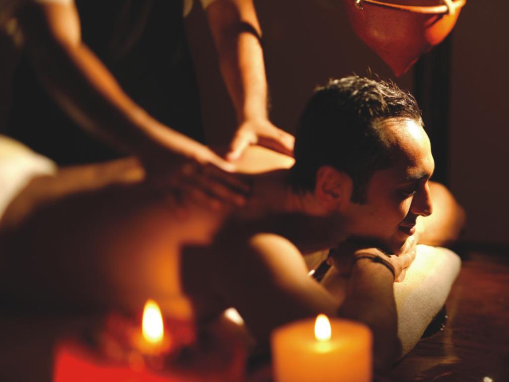 The Lalit Mumbai Hotel Bagian luar foto A massage therapist working on a client